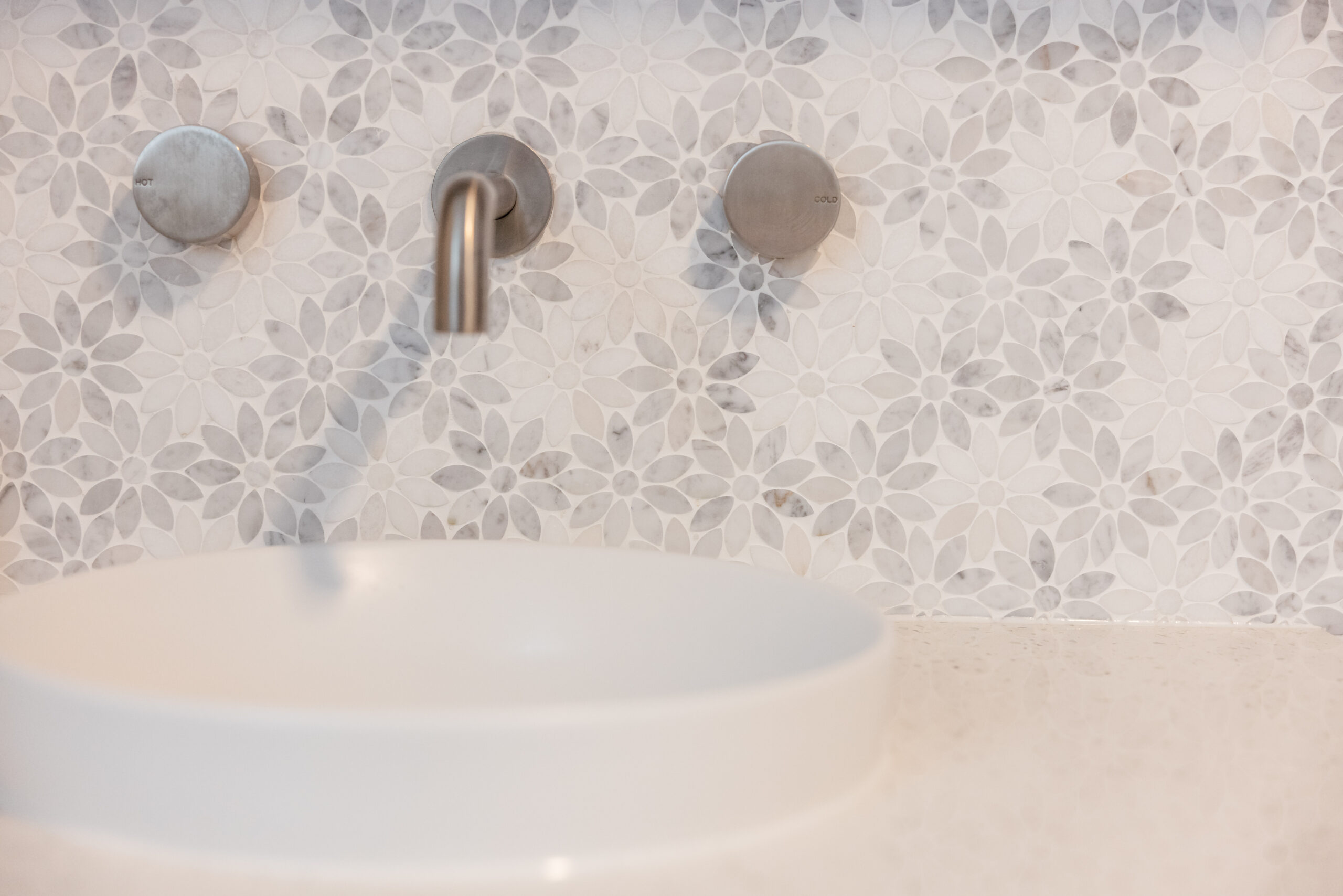 A detail of the intricate mosaic bathroom tiling